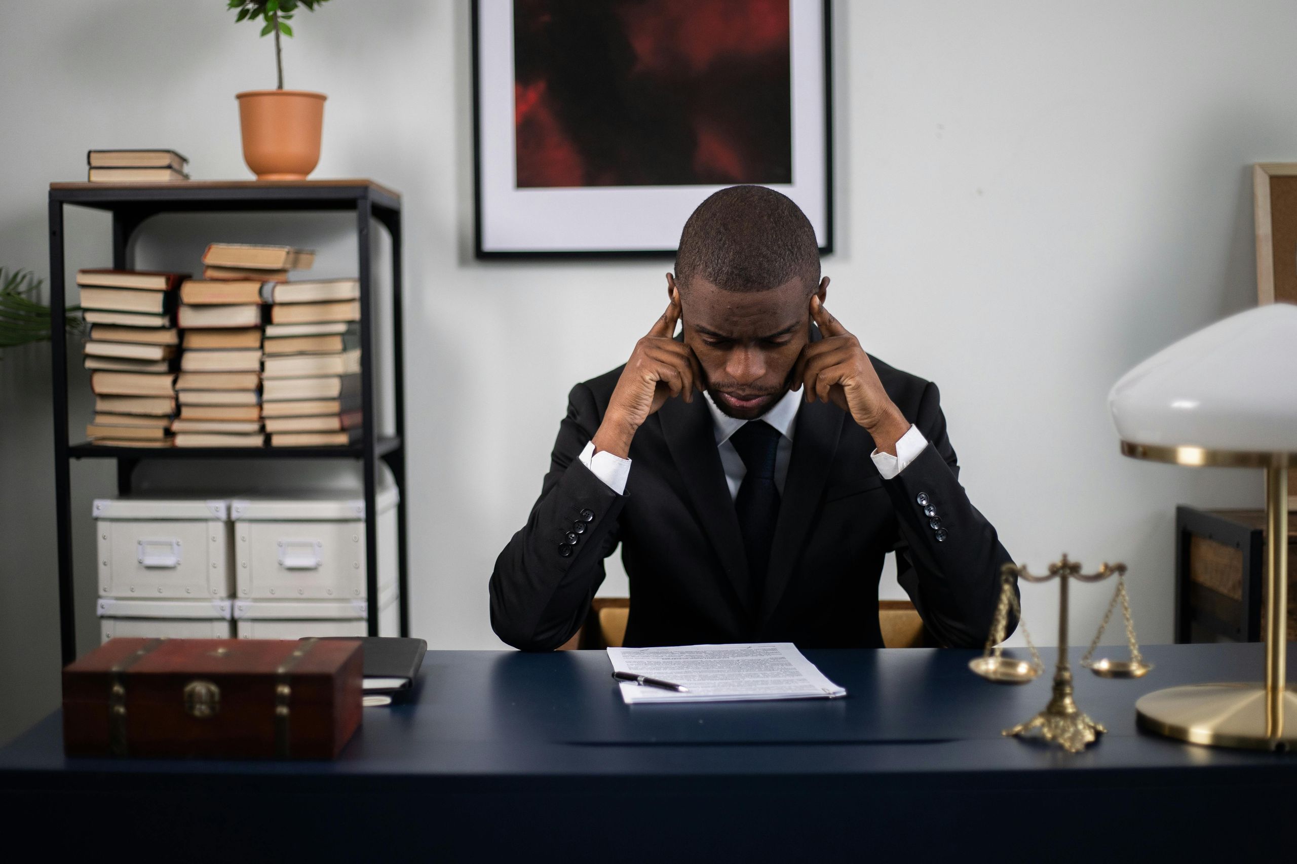Professional carefully reviewing workplace documents