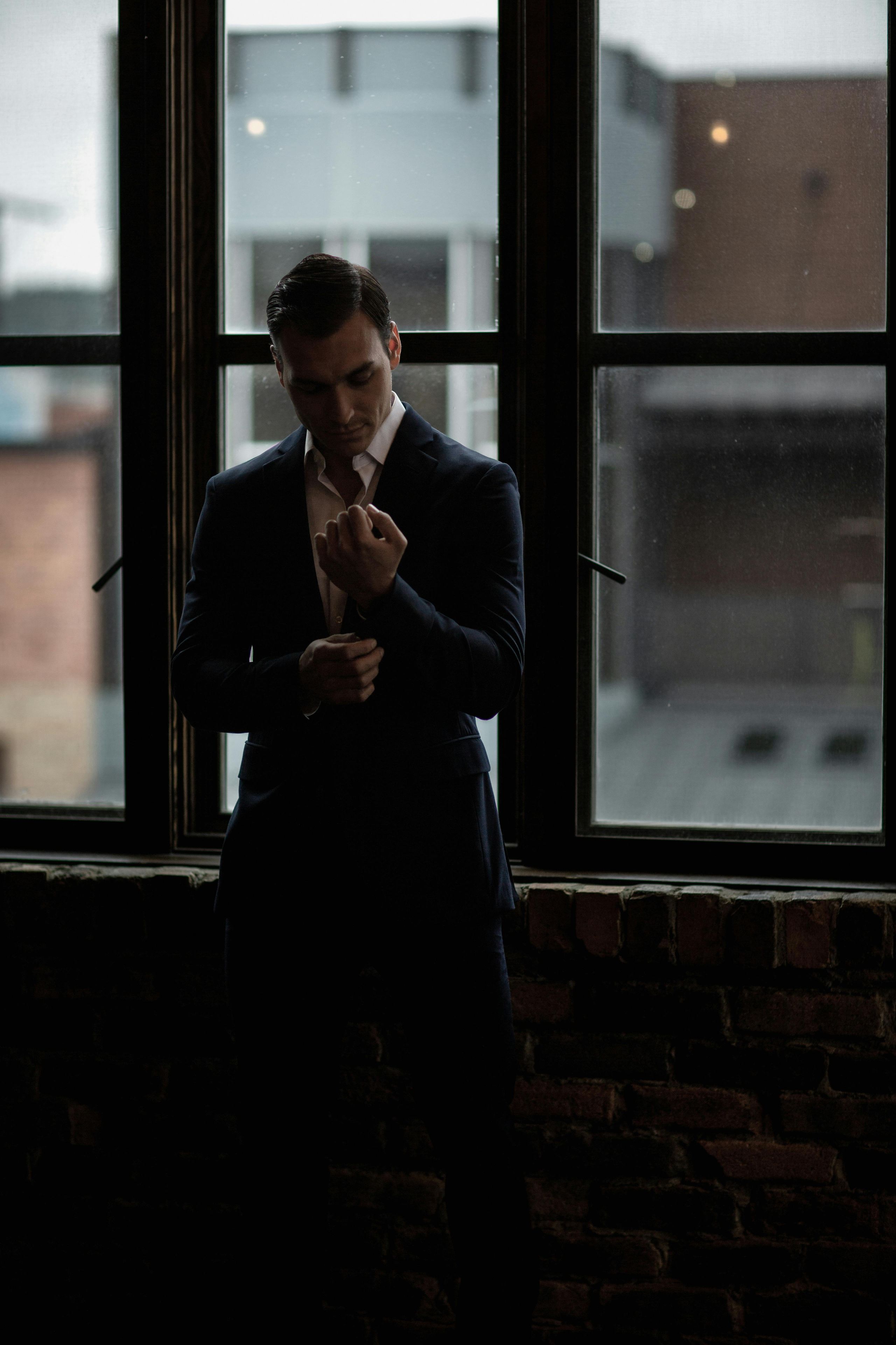 Professional at a crossroads — looking out at the city