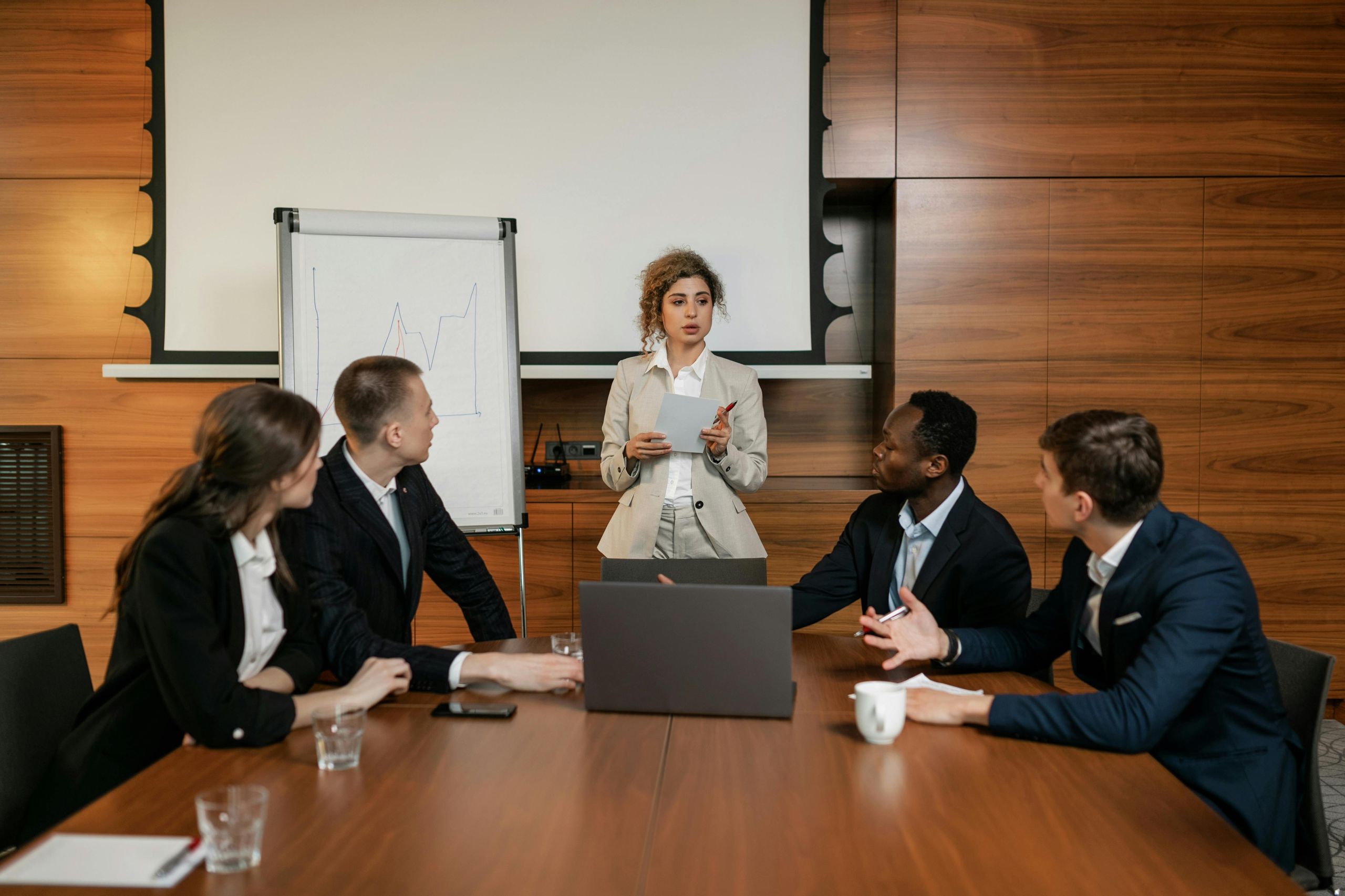 Manager addressing employee in a workplace meeting