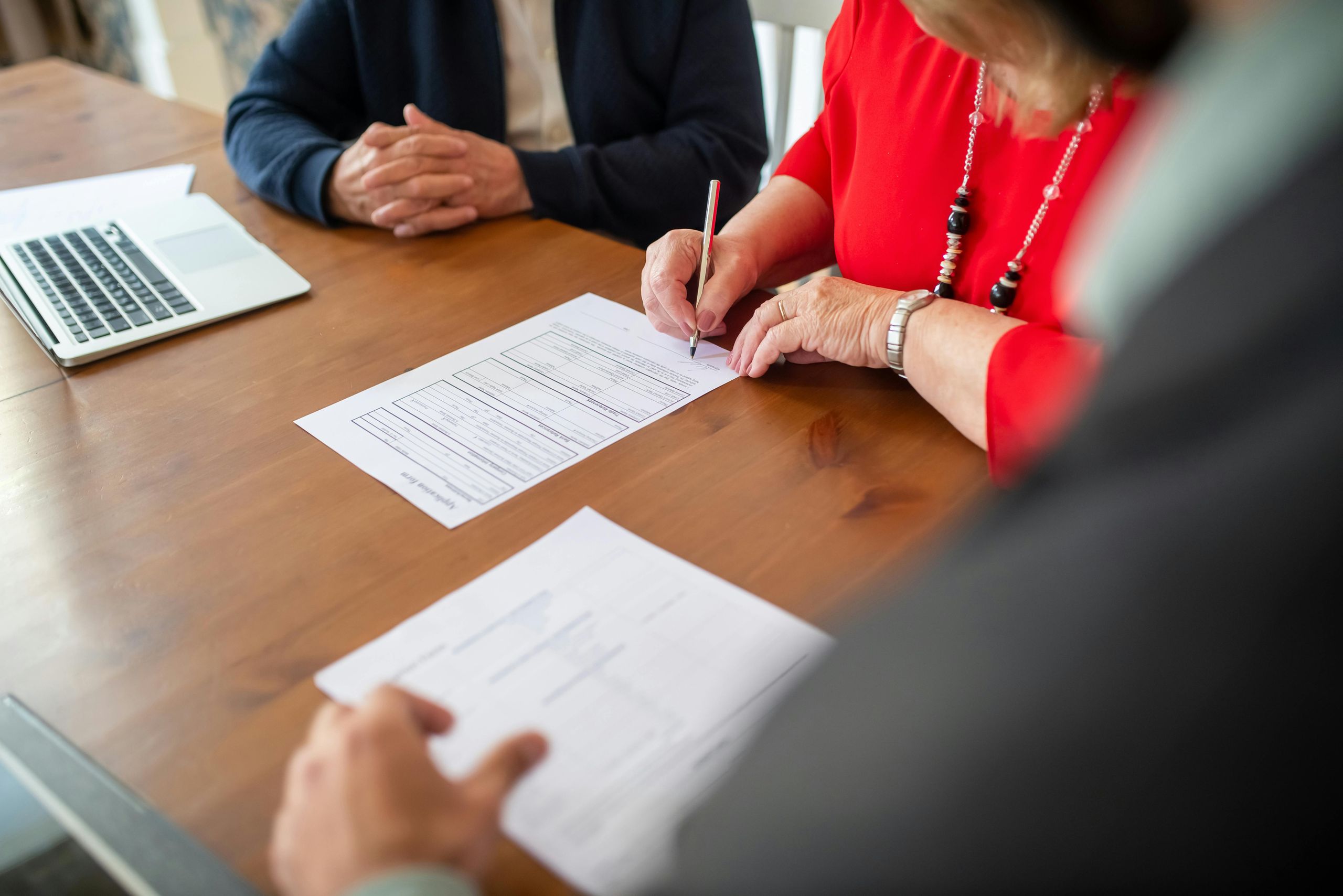 Professional reviewing and signing an exit agreement